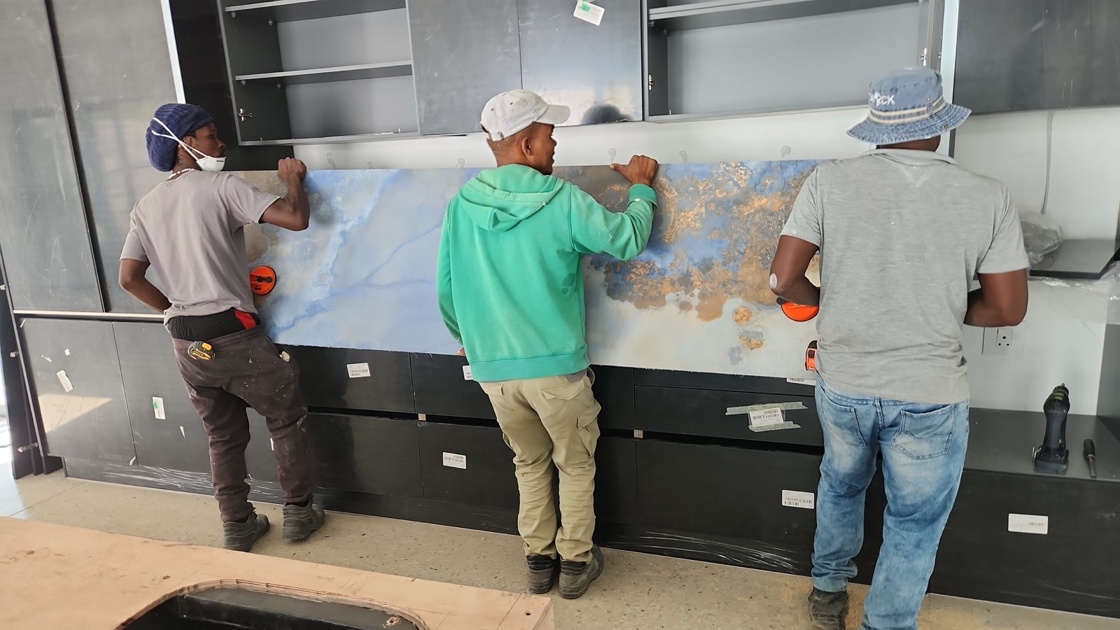 The team, setting a backsplash